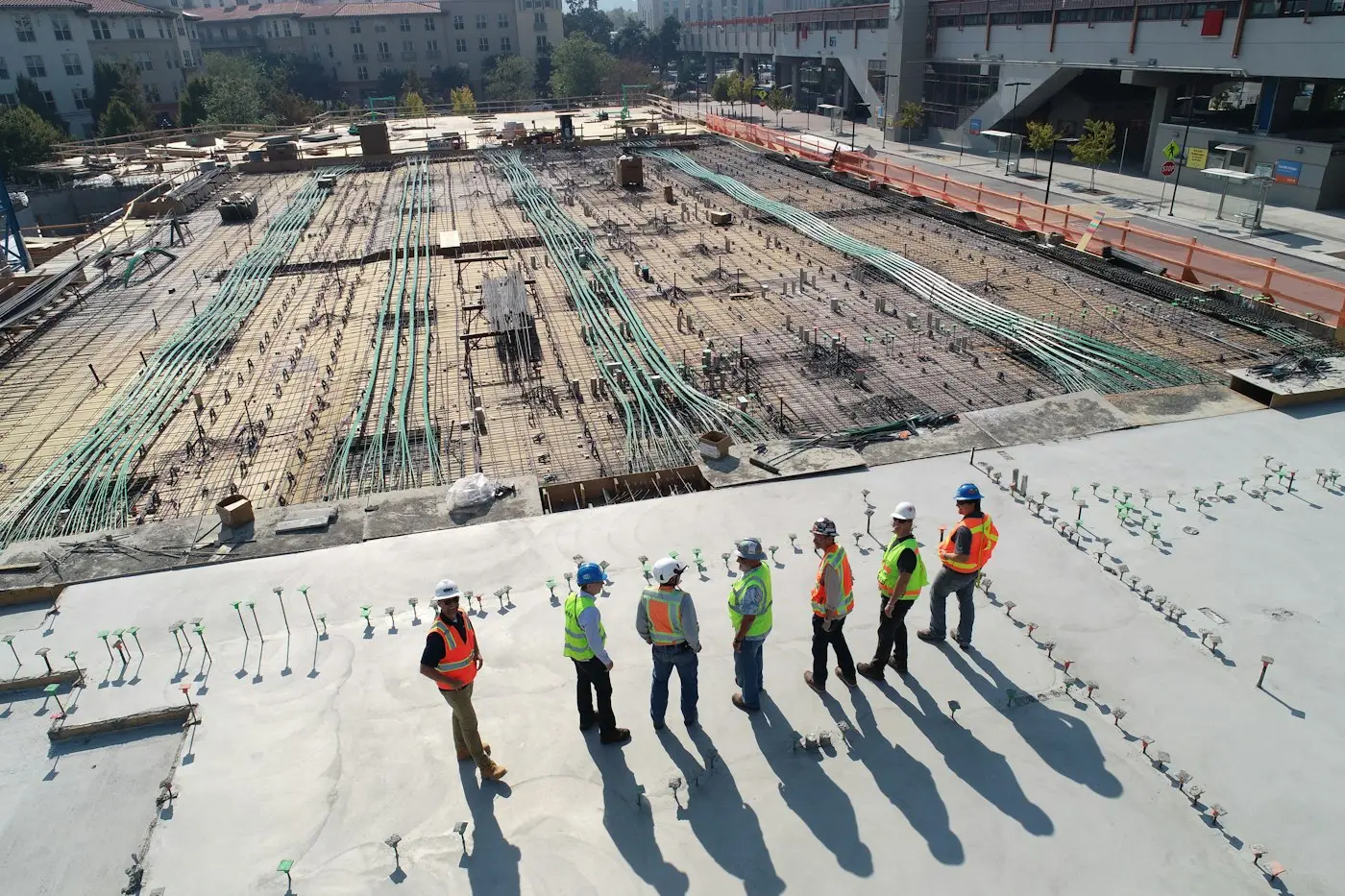 Site team reviewing the progress of a large foundation pour